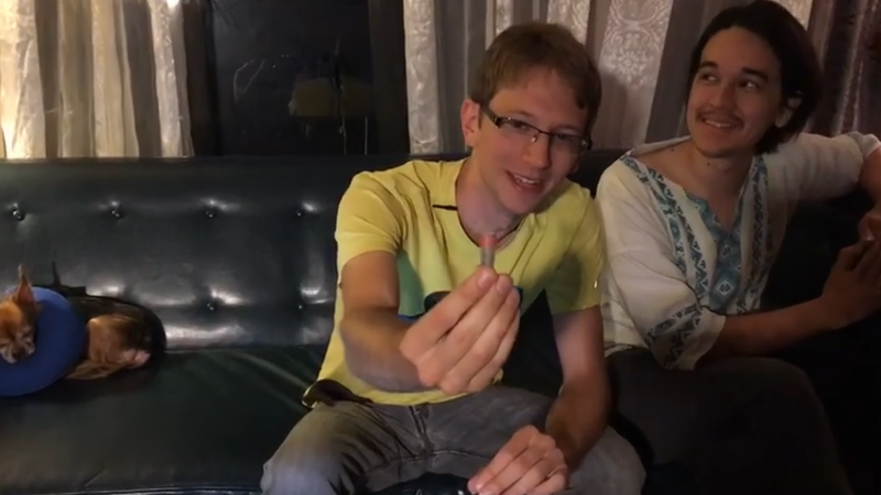 Tristan Roberts holds the DNA he is about to inject himself with. (Image: Ford Fischer)